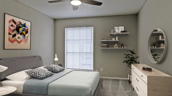 a bedroom with a ceiling fan and a bed at The Westmount at River Park