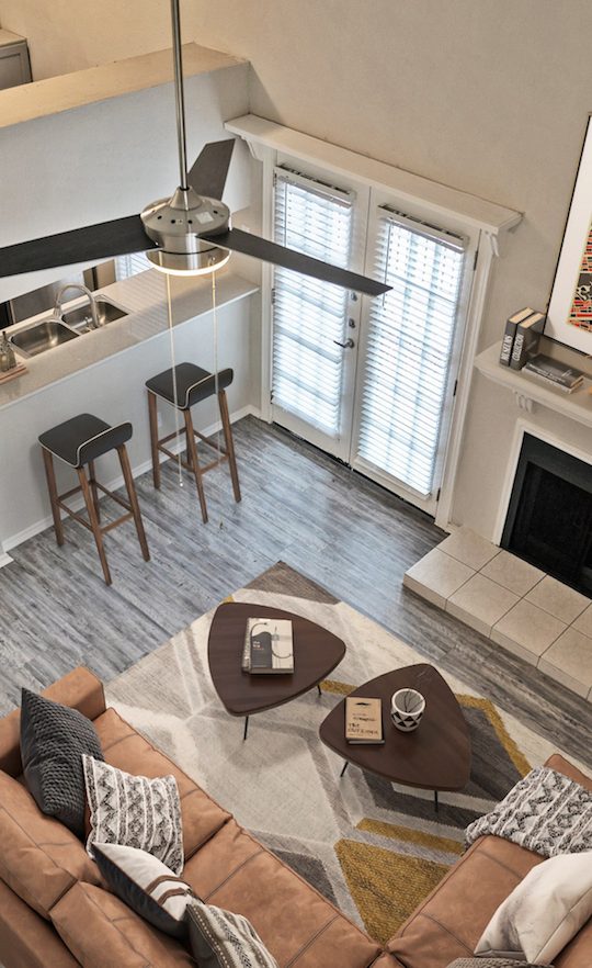 a view of a living room and kitchen from above at The Westmount at River Park