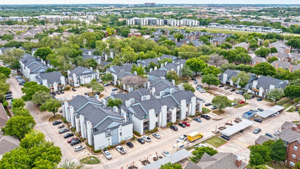 an aerial view of a residential neighborhood with trees and lots of houses at The Westmount at River Park